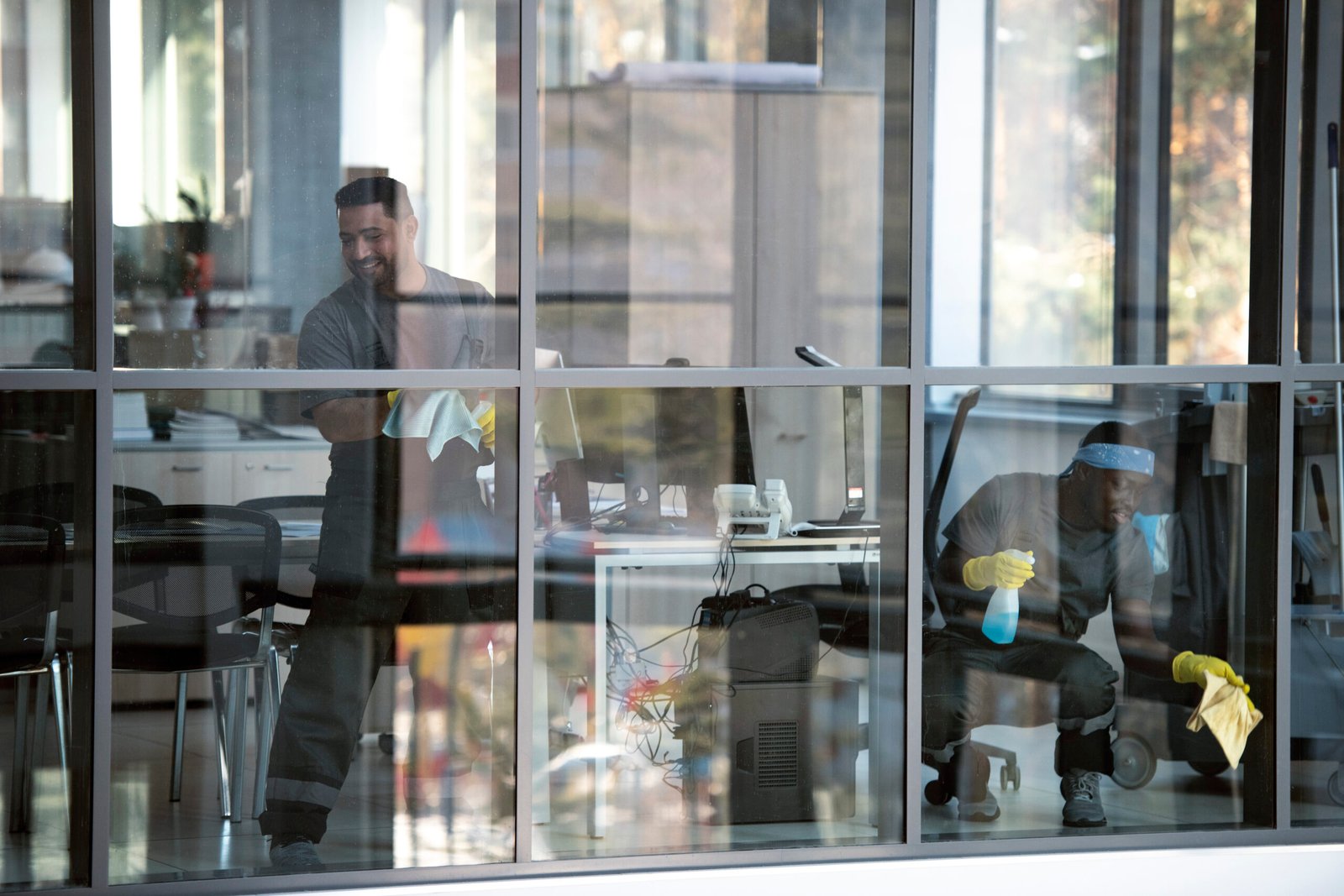 full shot smiley man cleaning window scaled